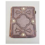 Antique embossed leather photo album with some