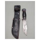 WWII era survival knife with stack leather and