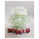 Carved jadeite sculpture featuring an urn and