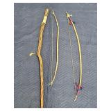 Native American style bows and walking stick