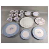 Group of porcelain plates, saucers, and tea cups