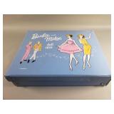 Group of vintage Barbie dolls in case with