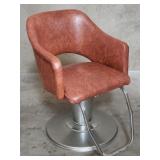 Faux leather and chrome salon styling chair