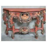 Baroque-style carved wood console table with