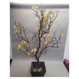 Artificial tree in wood planter