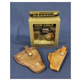 Lot of 2 leather holsters plus 1 Master gun lock