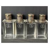 Four vintage glass perfume bottles with