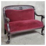 Antique upholstered carved mahogany love seat