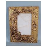 Vintage gold tone brass picture frame depicting