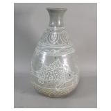 Vintage pottery vase with fish motifs