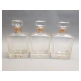 Three vintage crystal decanters