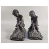 Pair of antique patina bronze clad bookends boy