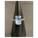 Sterling silver ring with emerald-cut blue topaz