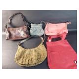 Group of womens designer style purses