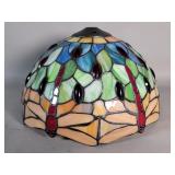 Stained glass lamp shade depicting a dragonfly