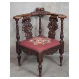 Antique Italian carved walnut corner arm chair