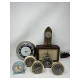 Group of vintage alarm clocks with a watch