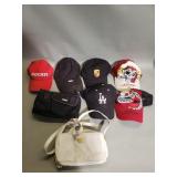 Group of hats and pair of hand bags
