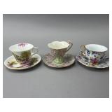 Three Floral Porcelain Teacups with Saucers