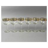 Six Gold-Trimmed Stemmed Glasses