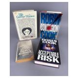 Four Hardcover and Paperback Books