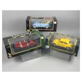 Three Boxed 1:18 Scale Die-Cast Model Cars VW BMW
