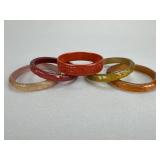 Carved Red Resin and Lucite Bangle Bracelets
