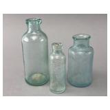 Three Clear Glass Bottles