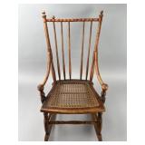 Wooden Rocking Chair With Cane Seat And Spindle