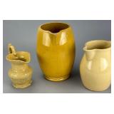 Set of Three Yellow Ware Pitchers