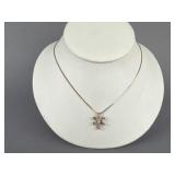 10K RG 1/8 CT TW Diamond in Motion Pendant