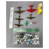 Plastic Toy Airplanes, Dice, and Marbles