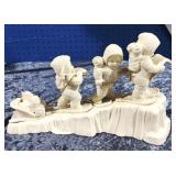 Snow Babies pulling sled