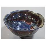 Pottery bowl with holes