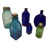 Assorted Colored Bottles and Jar