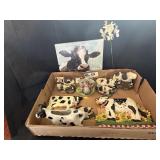 Flat of  Vintage Holstein Cow statuetts, creamer