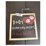 Sign 'Dogs leave paw prints'