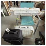 Patio chair, mini blinds, box fan, luggage