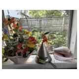 Basket with flowers, strainer, shell