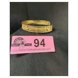 Vintage gold-tone hinged bangle with safety chain
