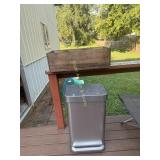 Garbage can and wooden box