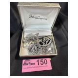 Silver tone charm style necklace, several chains