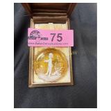 Vintage round brooch features yellow glass