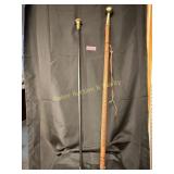 Pair of vintage walking sticks, one wood