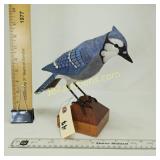 BLUE JAY ON A FENCE POST