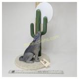 GRAY WOLF HOWLING AT THE MOON