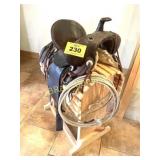 ANTIQUE SADDLE ON SADDLE STAND