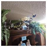 FLOWERS ON TOP OF CHINA CABINET