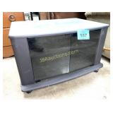 TV STAND ON CASTERS W GLASS DOORS
