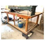 4X8 WORK TABLE, ONE CASTER BROKE